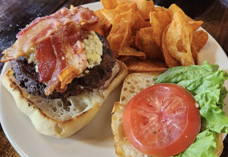 Weidmann's Restaurant signature dishes Boudin Stuffed Pork ChopWeidmann’s Bleu Cheese and Bacon BurgerChicken St. Francis